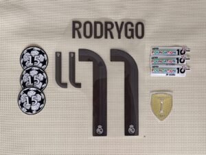 Set Real Madrid Rodrygo local Kit 2025 UCL dorsal+ 3 parches
