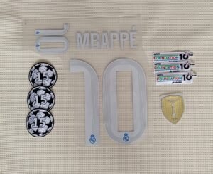 Set Real Madrid Mbappe alternativa Kit 2025 UCL dorsal+ 3 parches.