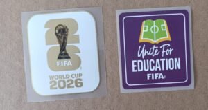 Set de parches WC 26 blanco con dorado + UNITE FOR EDUCATION morado